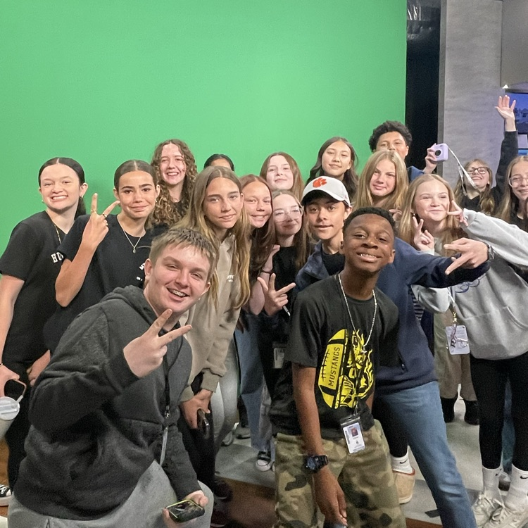 Group of mtv students, smiling at news station