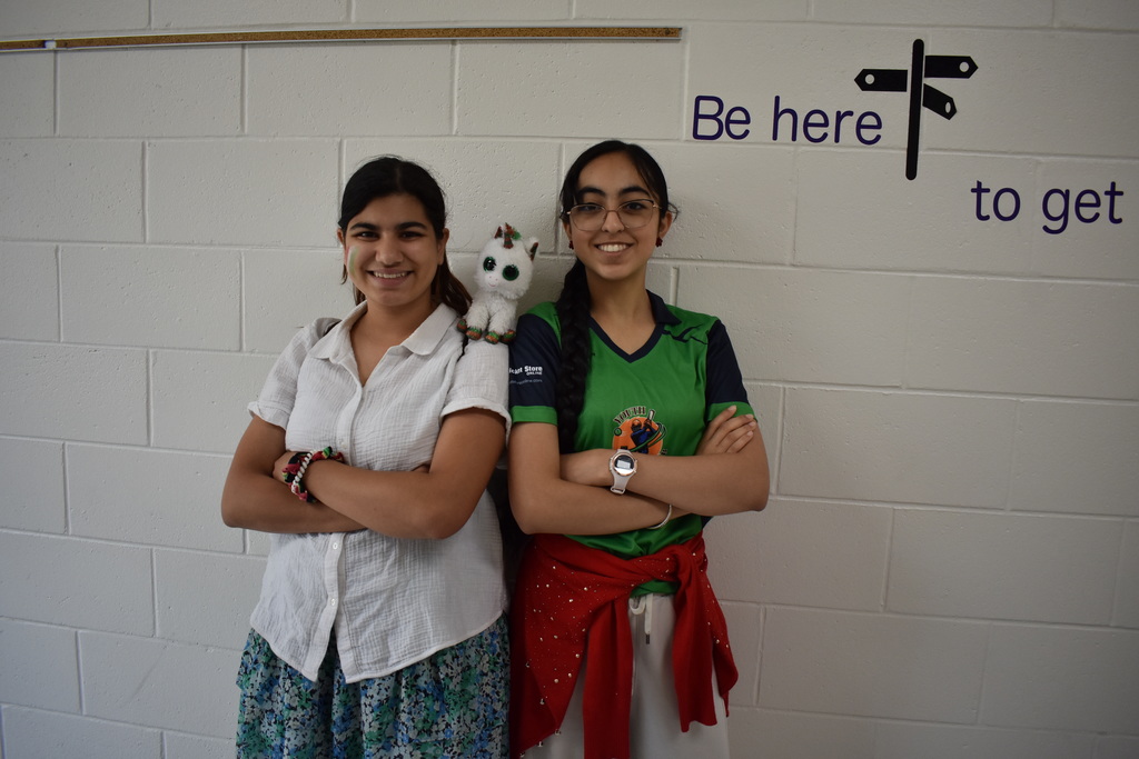 Two Students dressed in the colors on the Mexican flag celebrating Cinco De Mayo