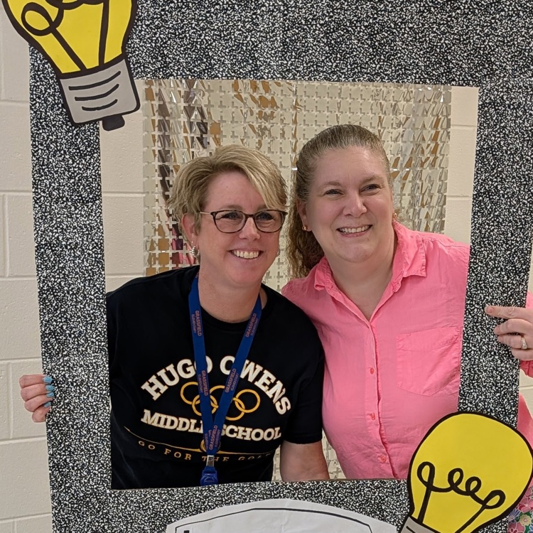 teacher smiling at selfie station