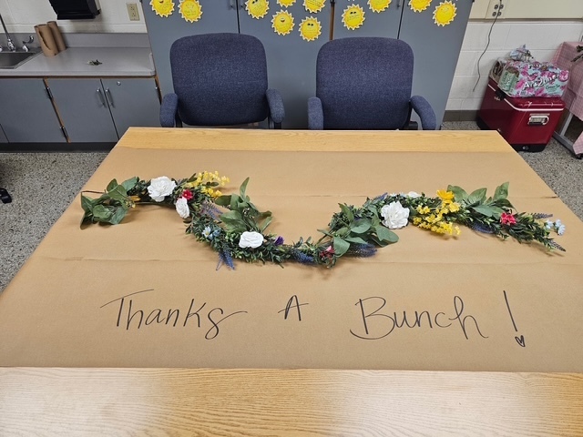Thanks a bunch sign with flowers.