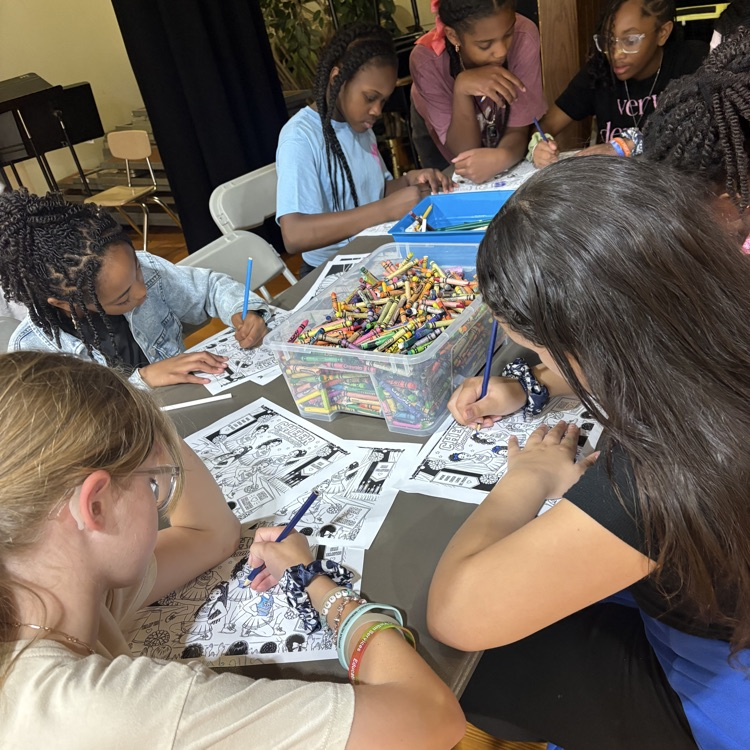 Cheer team around a table coloring.