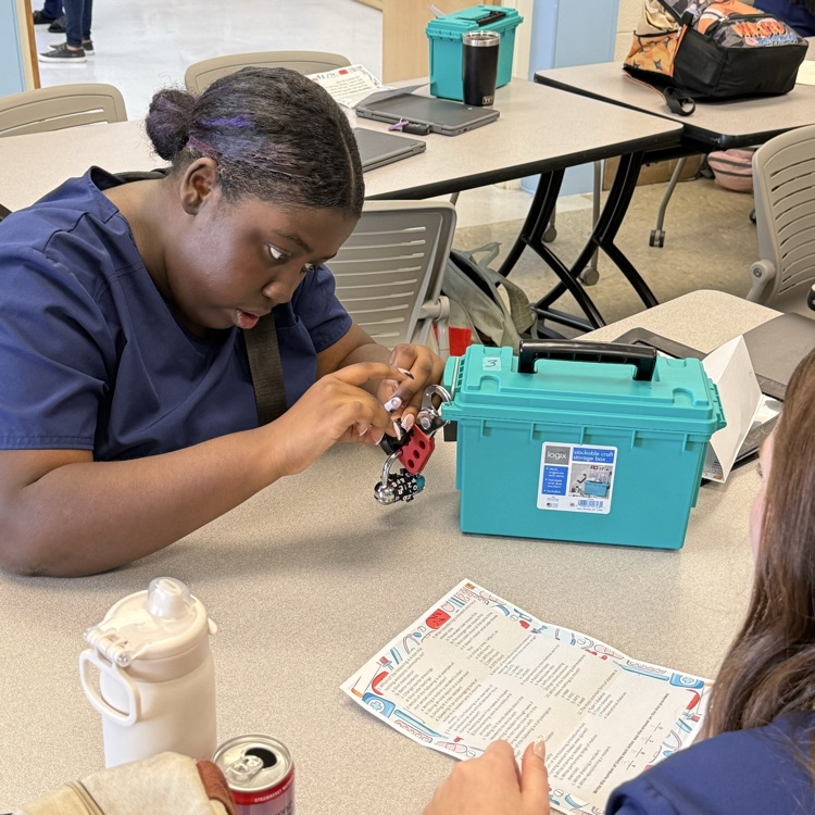 students working together on the break out box