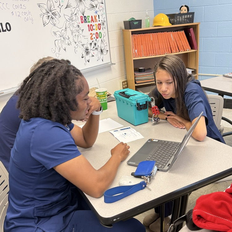 students working together on the break out box