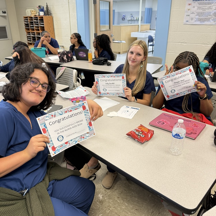 students with their certificates for completing the activity