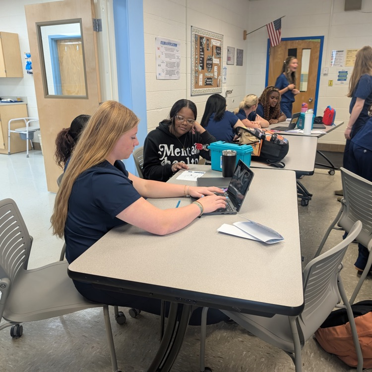 students working together on the break out box