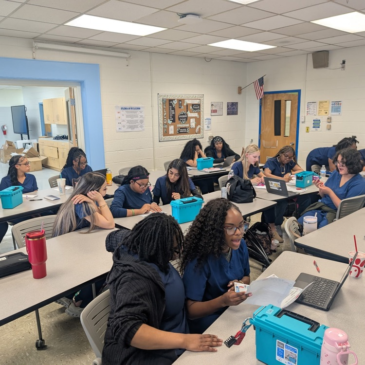 students working together on the break out box