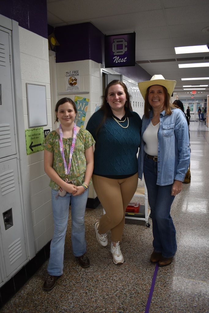 A preppy teacher and a country teacher and student