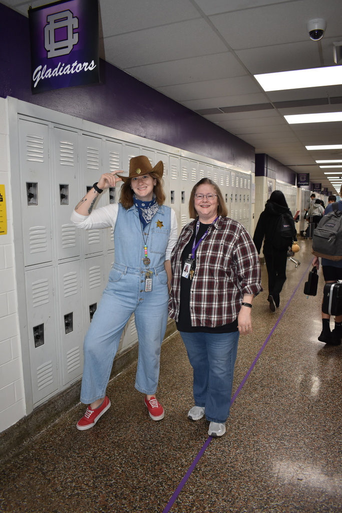 Two teachers dressed in their country outfits