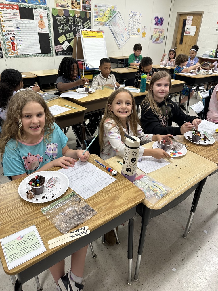 Students at desks with treat