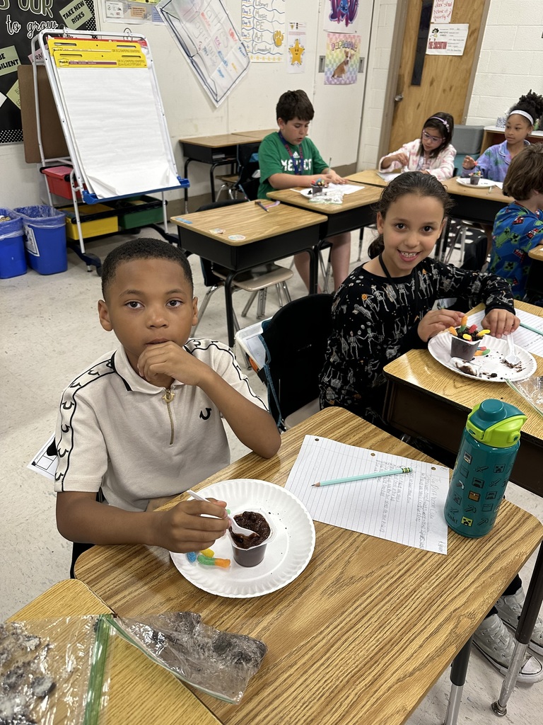 Students at desks with treat
