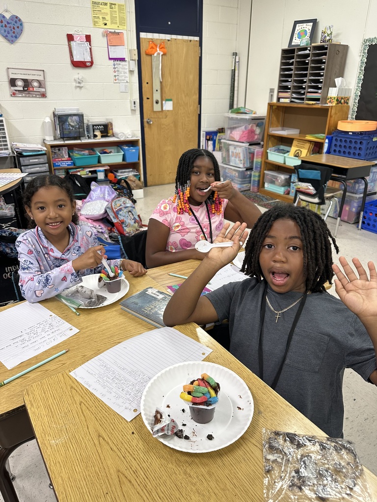 Students at desks with treat
