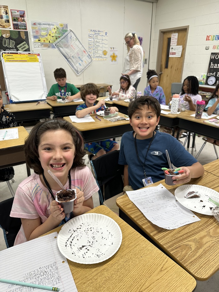 Students at desks with treat