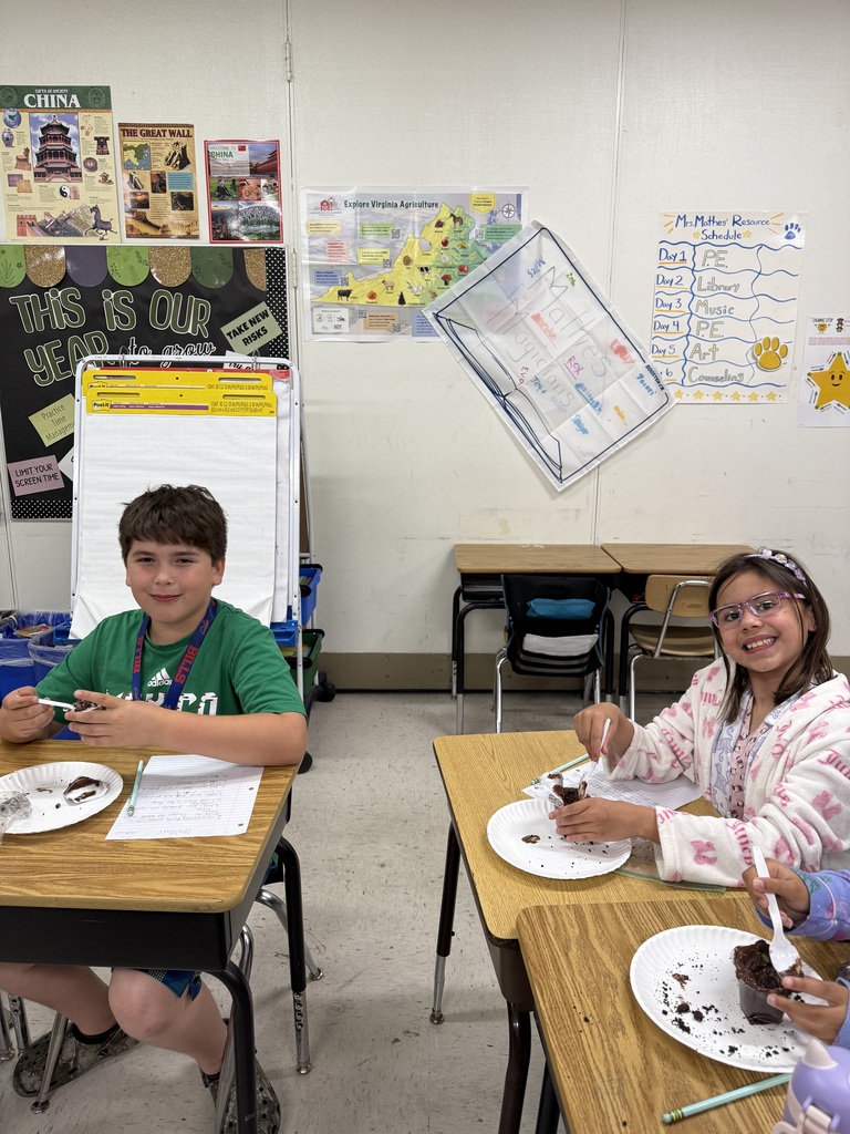 Students at desks with treat
