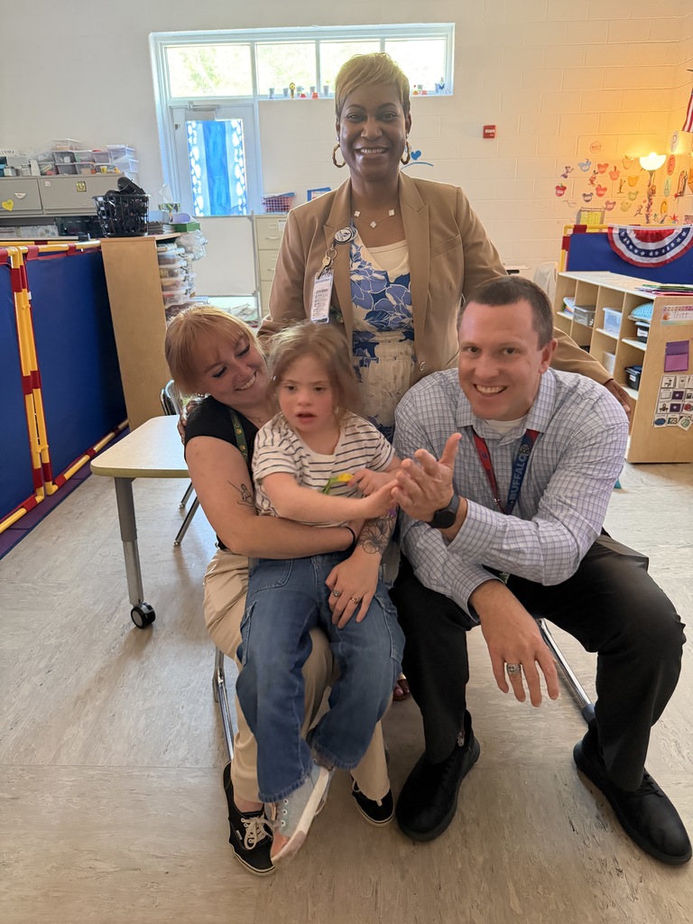 One of our April Students of the month, selected for showing cooperation, posing with admin and Ms. Little.