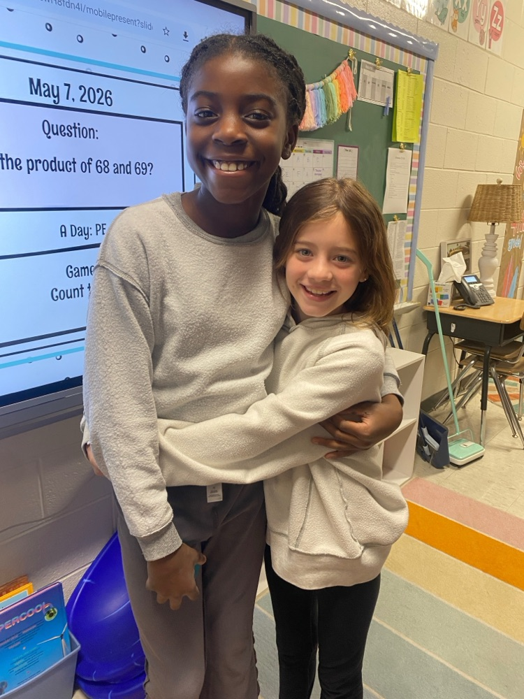     Students wearing shirts and sweatshirts inside out during a fun school spirit day challenge.