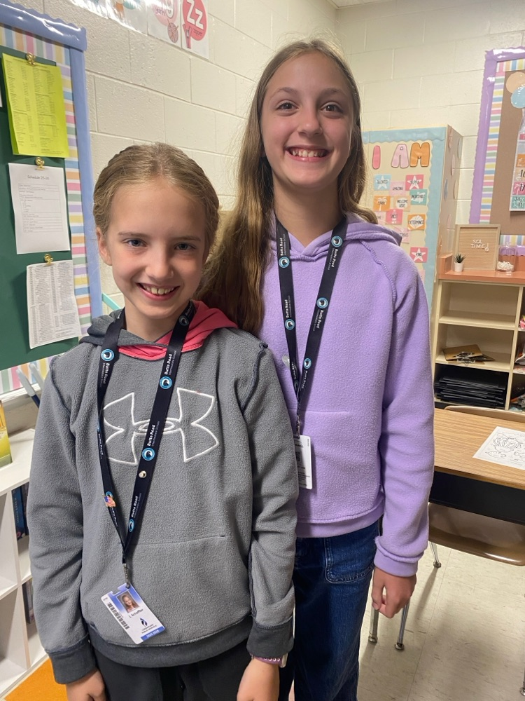     Students wearing shirts and sweatshirts inside out during a fun school spirit day challenge.