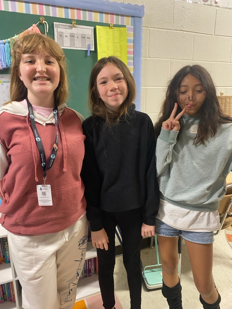     Students wearing shirts and sweatshirts inside out during a fun school spirit day challenge.