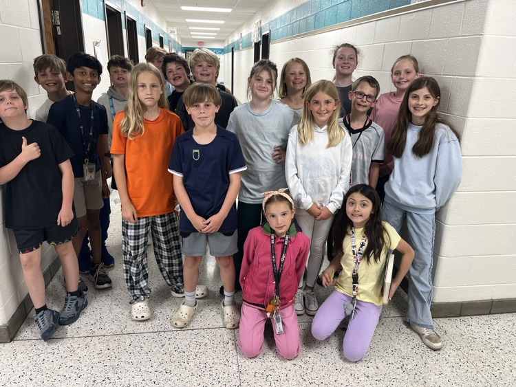     Students wearing shirts and sweatshirts inside out during a fun school spirit day challenge.
