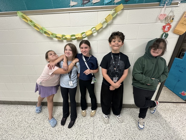     Students wearing shirts and sweatshirts inside out during a fun school spirit day challenge.