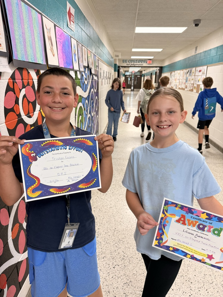     Students wearing shirts and sweatshirts inside out during a fun school spirit day challenge.