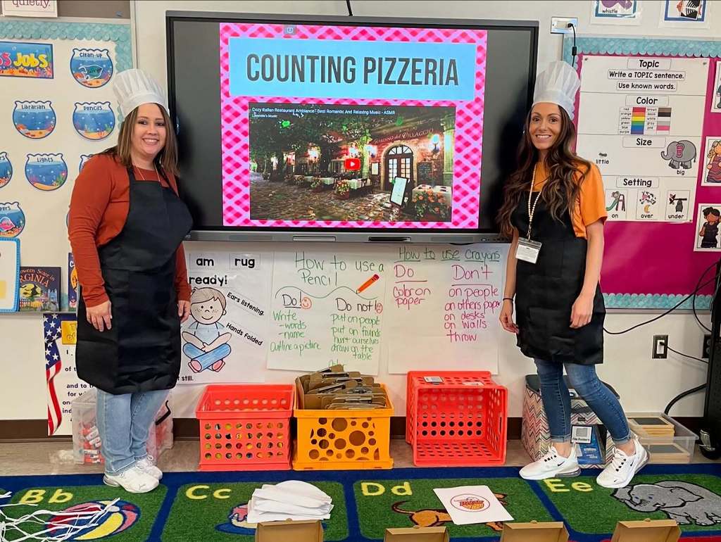 Mrs. Tucker and Mrs. Matson posing after their Counting Pizzeria lesson with their kindergarteners