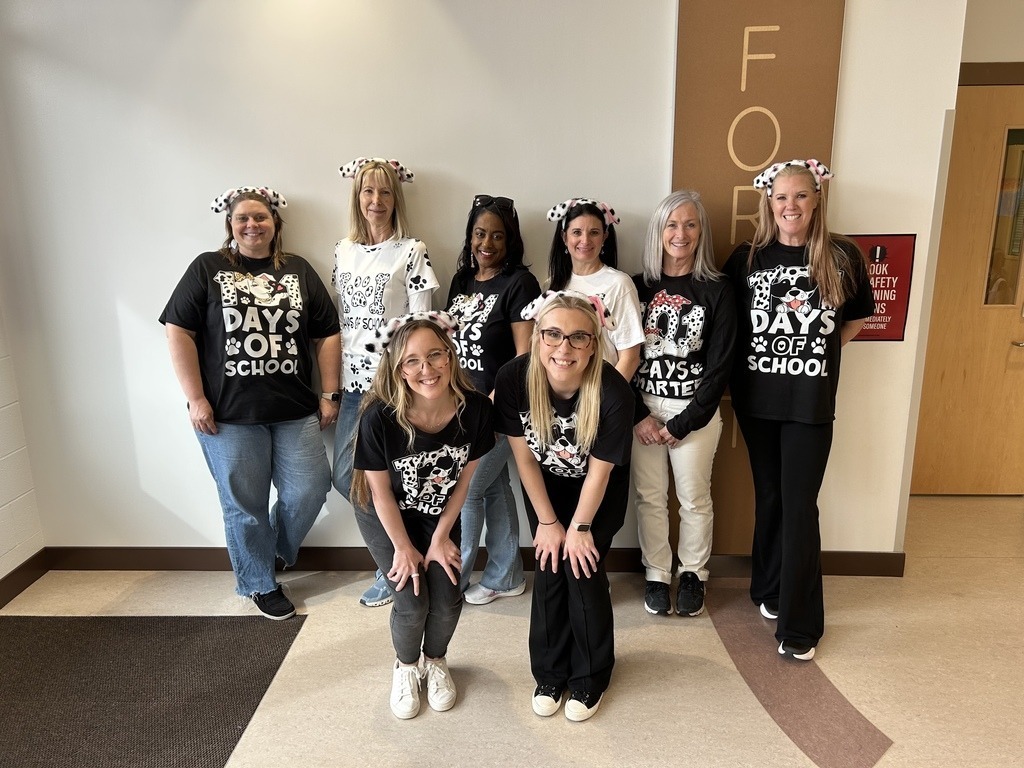 2nd grade teachers posing in their dalmatian shirts on the 101st day of school