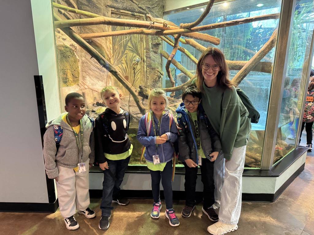 Mrs. HT posing with some of the students at the zoo