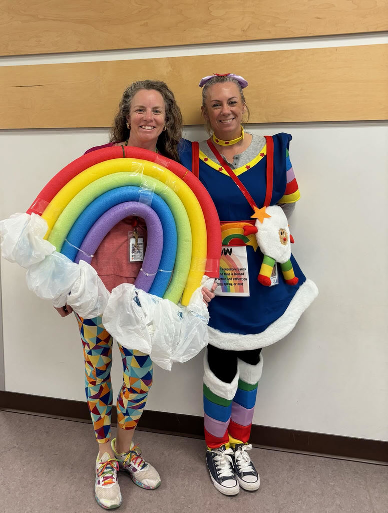 Two teachers dressed up as the word "Rainbow" on our Vocabulary Word dress up day