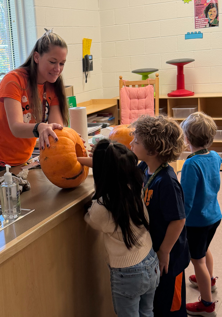 Ms. Kiskinis and her students having fun with pumpkin exploration