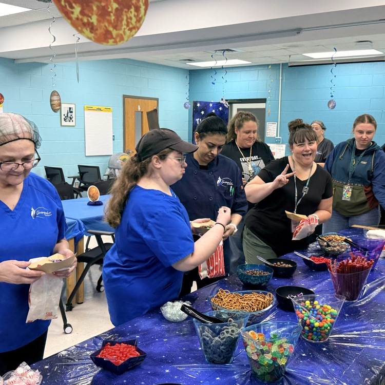 staff enjoying the popcorn and candy bar