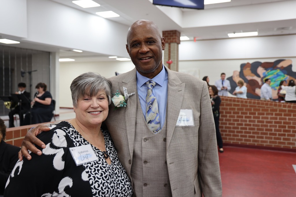 Two retirees smiling together.