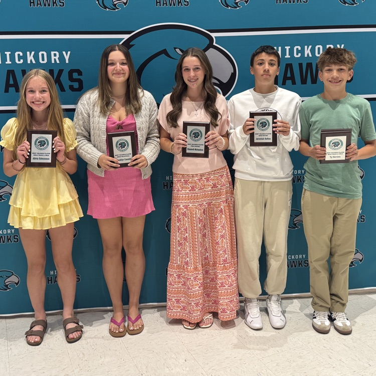 students posing with awards