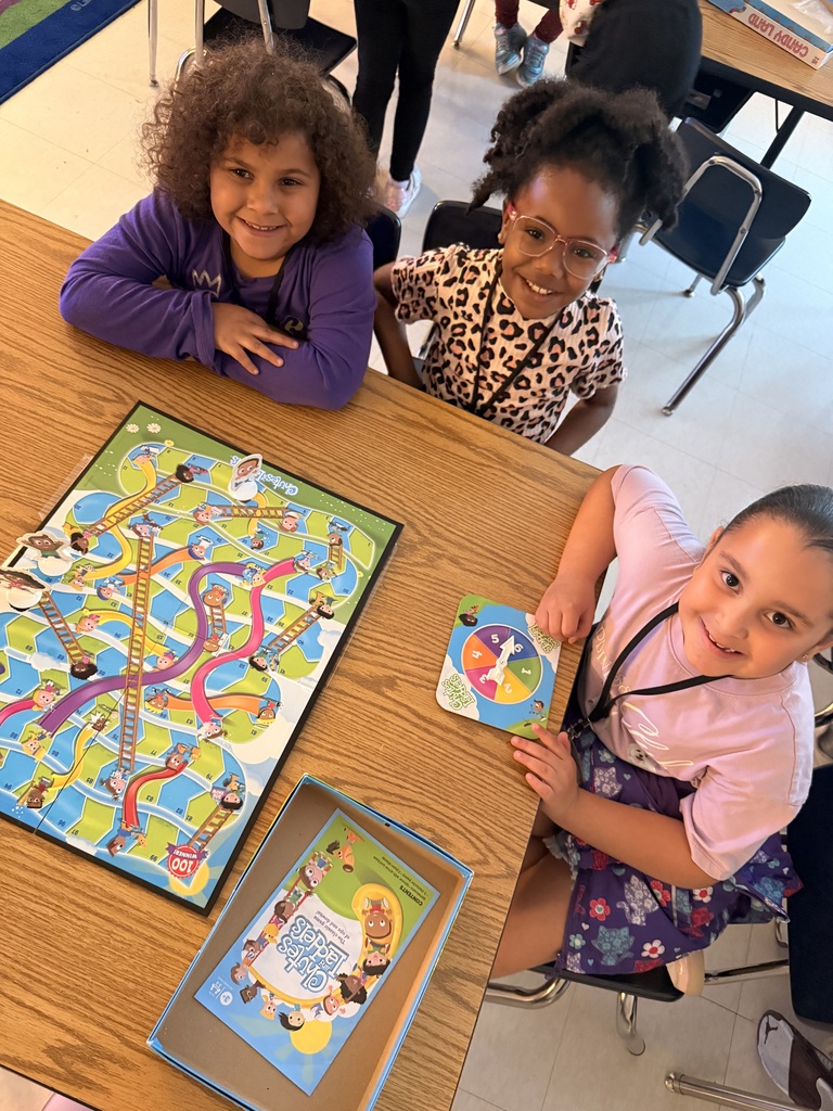 students play chutes and ladders as part of PBIS "Game Day" Reward