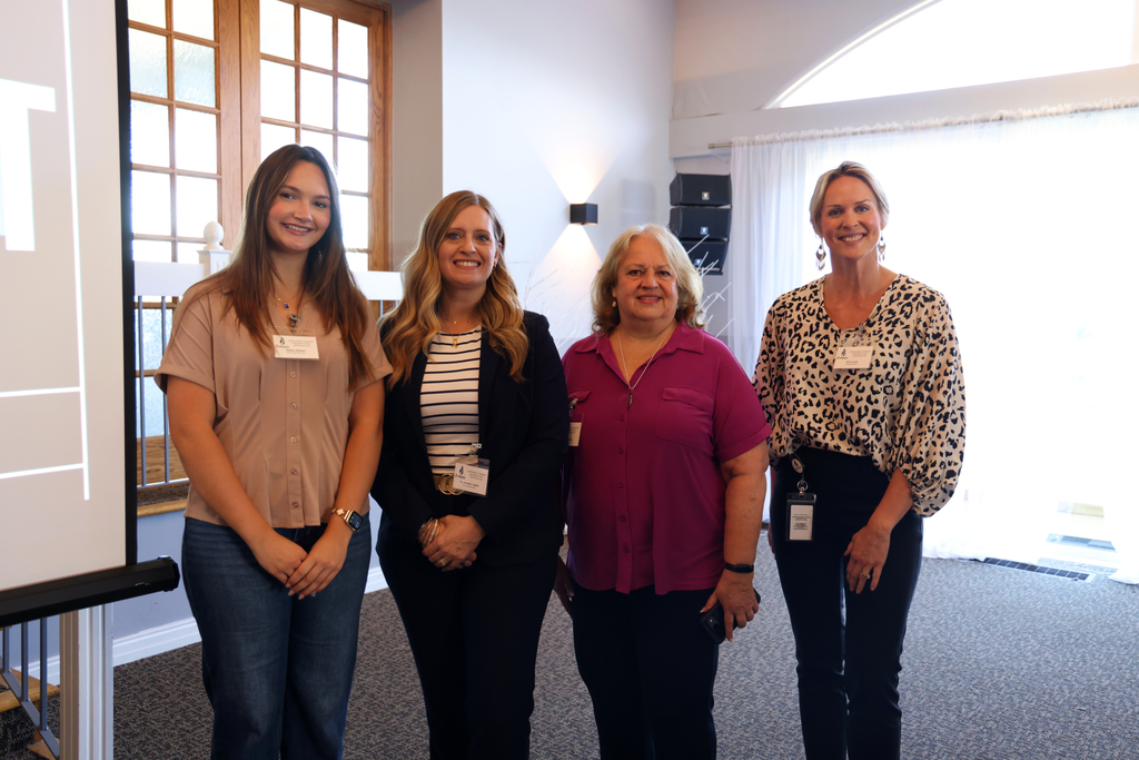 School Board members smiling with Addison.