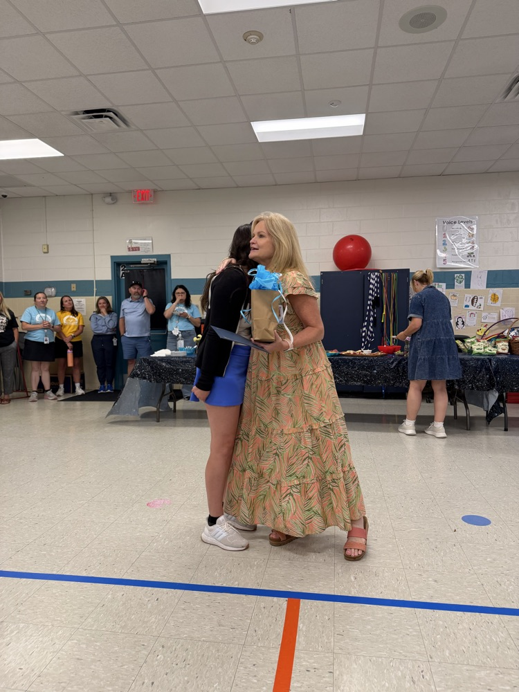 Principal hugging pta president
