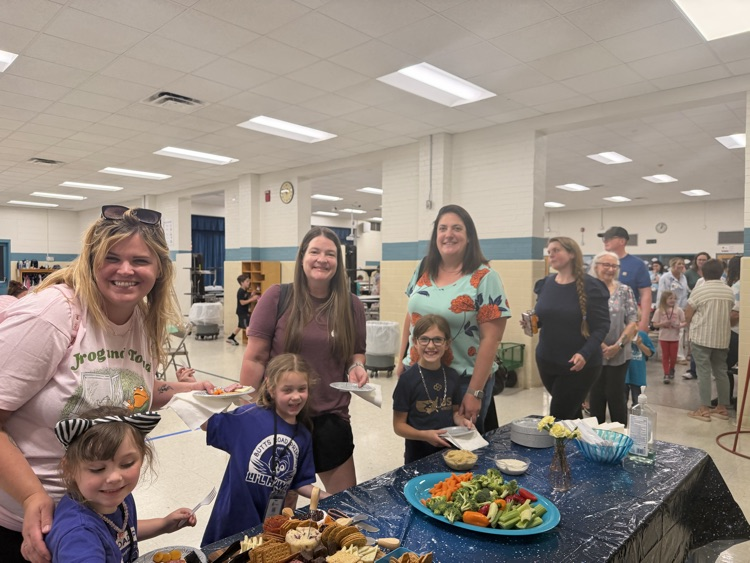 families getting food at celebration