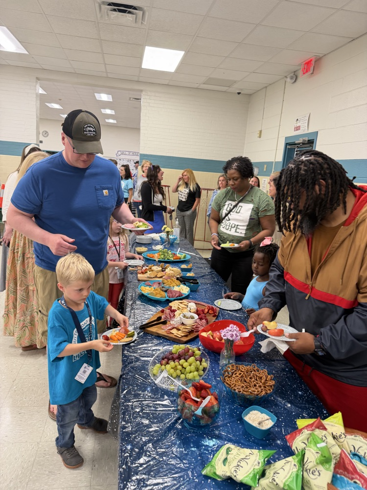 families getting food at celebration