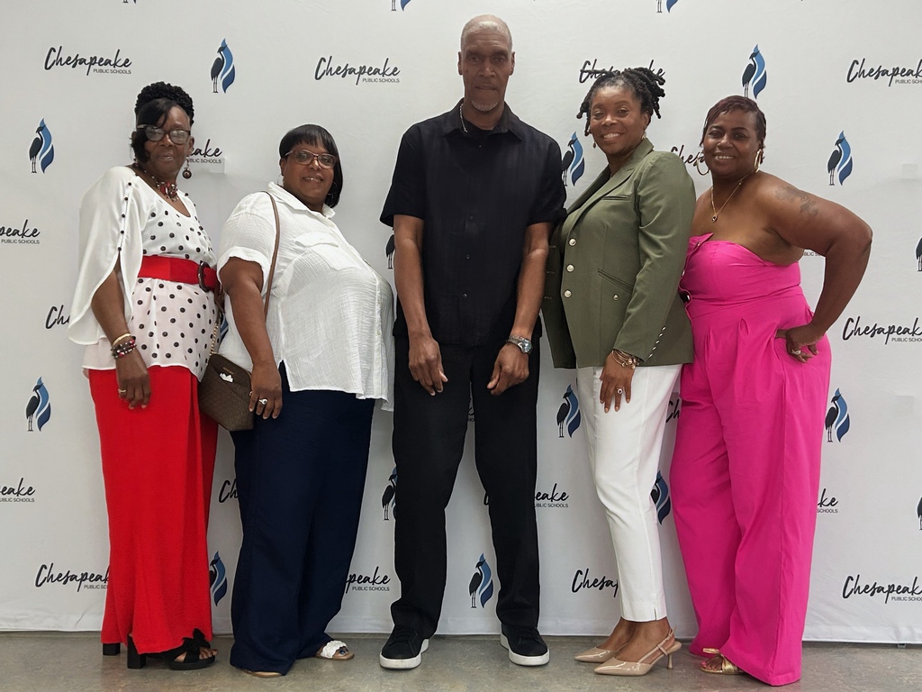 custodial team and assistant principal posing for a photo for the custodial awards. 