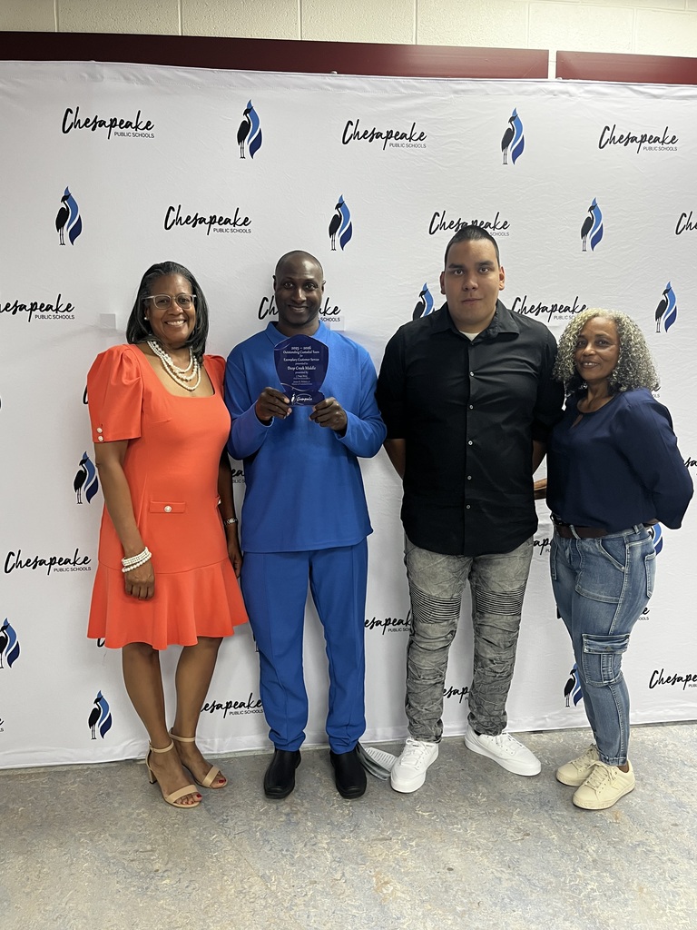 Our custodians and principal posing for their award!
