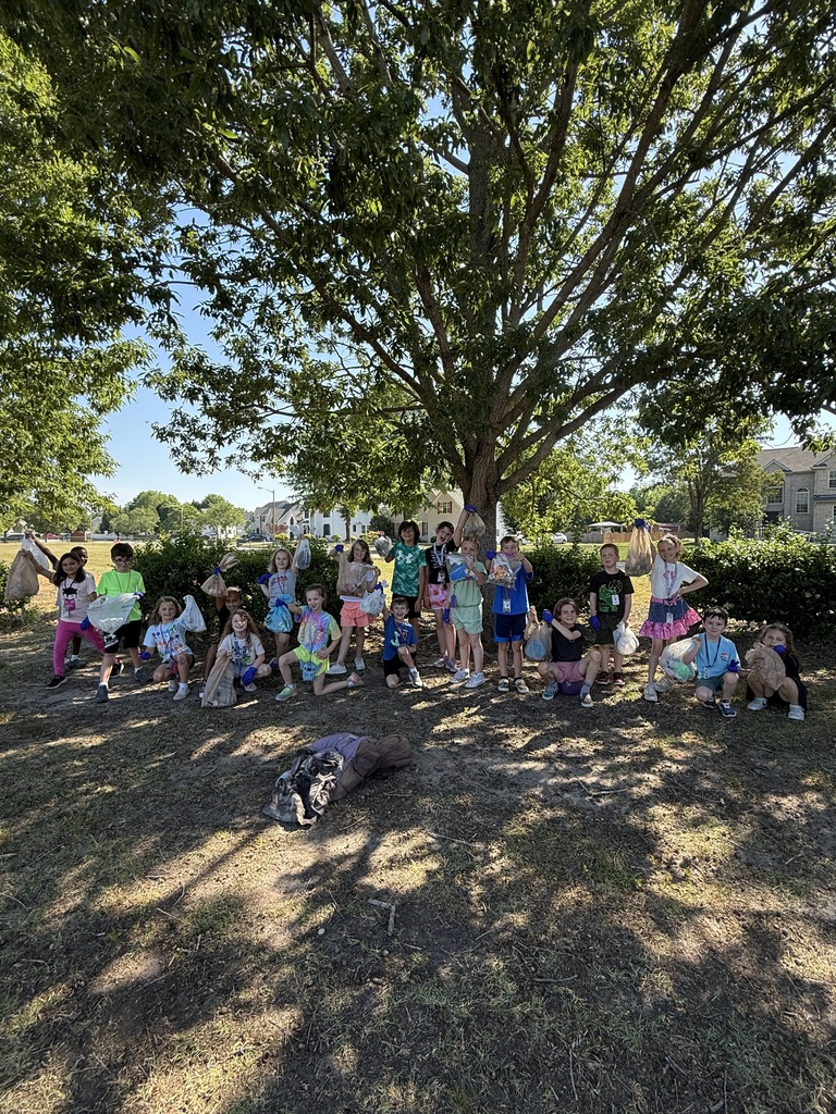 Mrs. Charlton's class outside picking up trash.