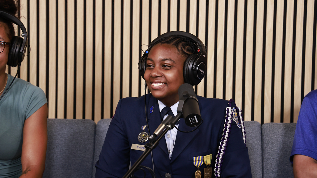 Myah Evans smiling during the podcast.