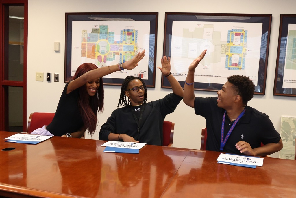 GFH celebrates their Guaranteed contract Recipients with a group high Five