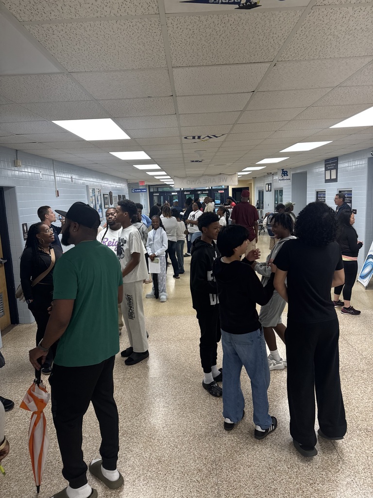 families attending an athletics information meeting at the school