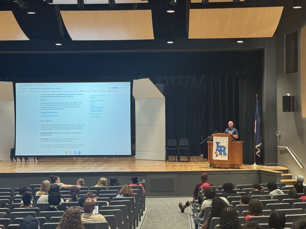 Student Activities Coordinator at the podium presenting to rising athletes for the 26-27 school year