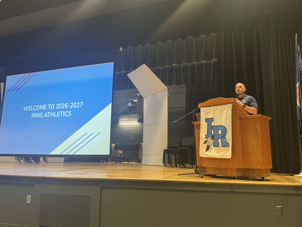 Student Activities Coordinator at the podium presenting to rising athletes for the 26-27 school year