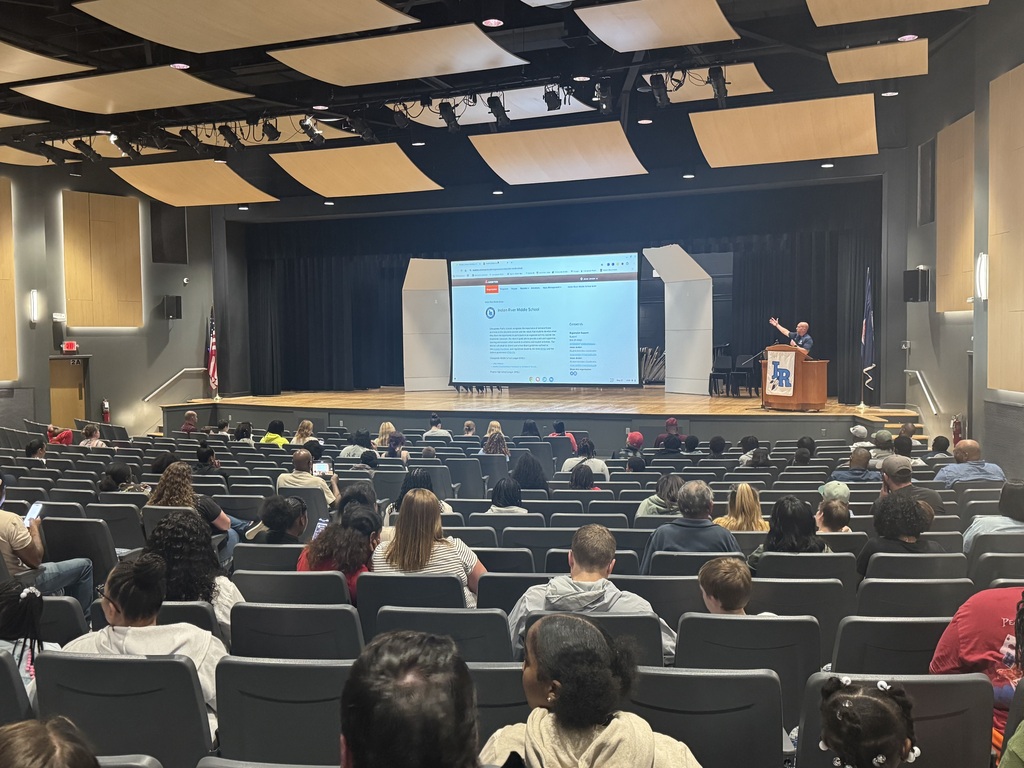 Student Activities Coordinator at the podium presenting to rising athletes for the 26-27 school year