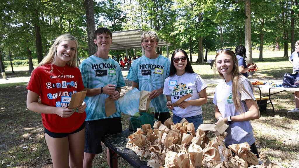 Students pose for a picture while completing a service project