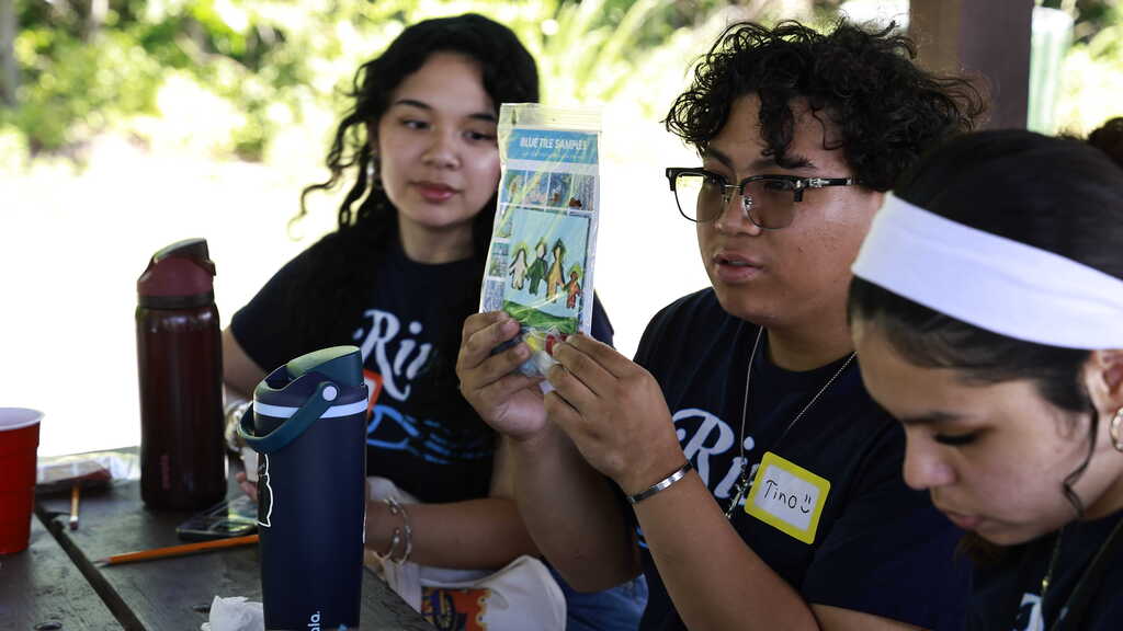 An IRH SCA member shows presents their completed project