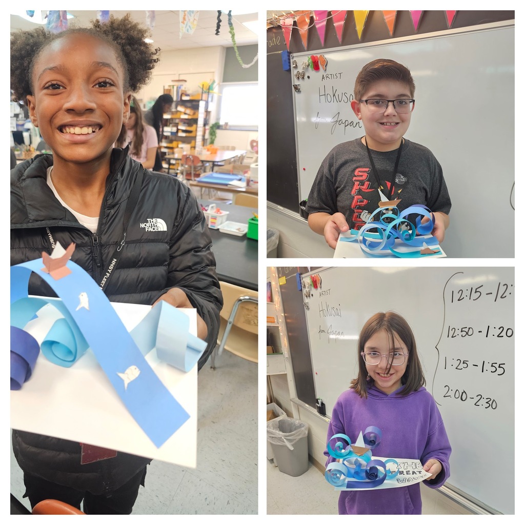 Students with wave sculptures