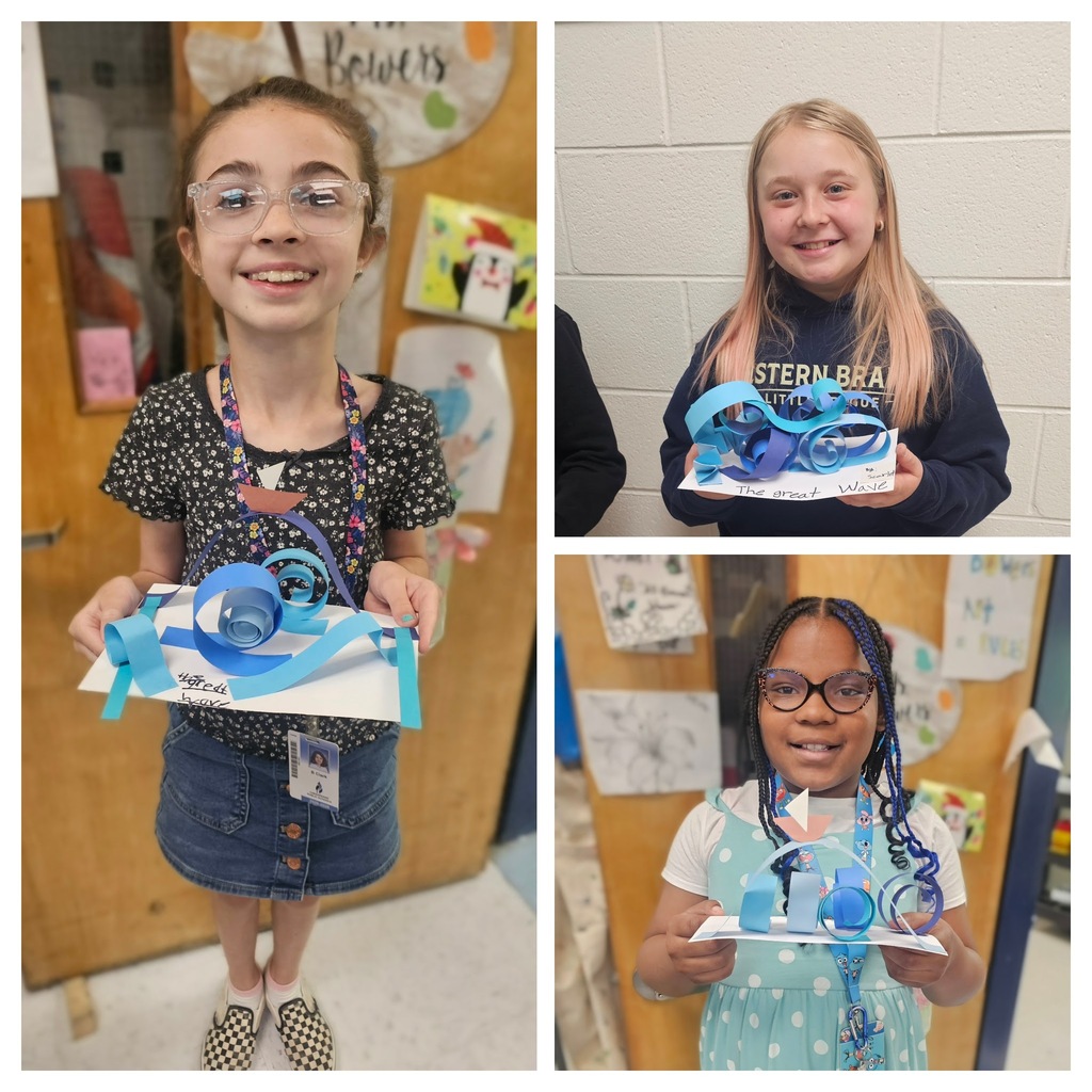 Students with wave sculptures
